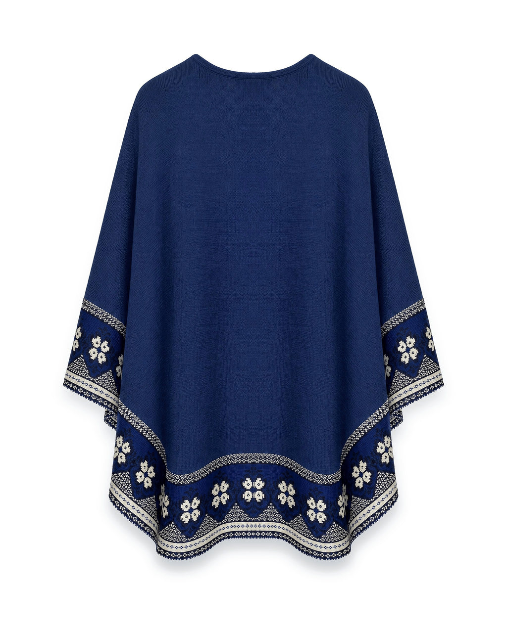 Poncho Flor de Imbabura visto de espalda, azul profundo con franja de flores blancas en el borde